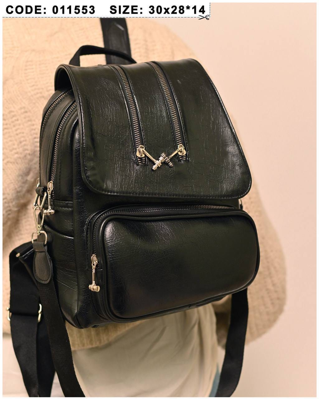 011553 — Black zip-detail backpack front, 30 × 28 × 14 (Black)