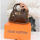 011599 — Brown mini charm barrel handbag front, 14 × 20 × 10 (Brown)
