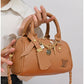 011599 — Tan mini charm barrel handbag detail, 14 × 20 × 10 (Tan)