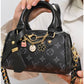 011599 — Black Patterned mini charm barrel handbag detail, 14 × 20 × 10 (Black Patterned)