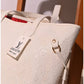 013650 — White embossed tote with matching pouch detail, 32 × 48 × 15 (White)