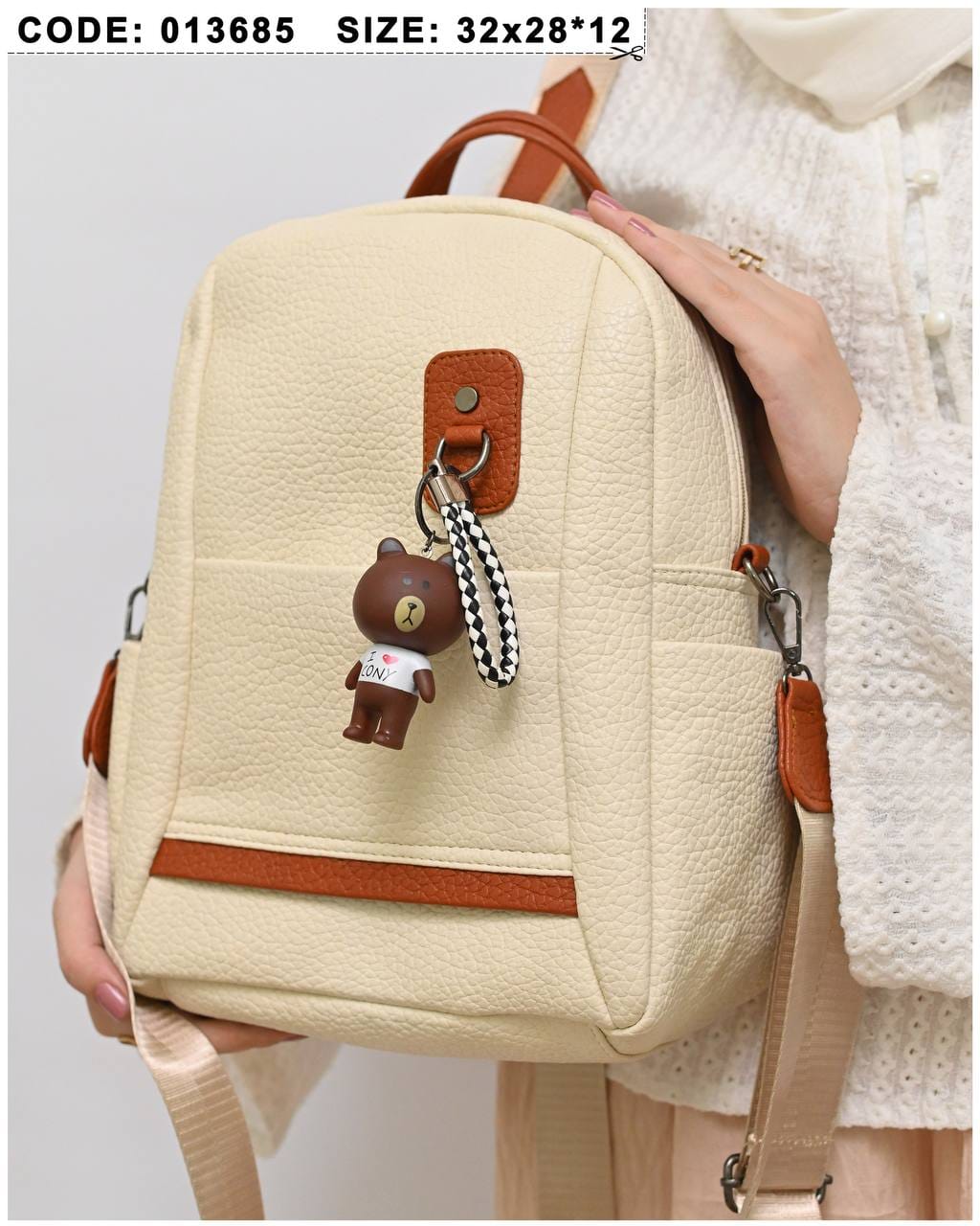 013685 — Cream bear-charm backpack front, 32 × 28 × 12 (Cream)