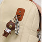 013685 — Cream bear-charm backpack detail, 32 × 28 × 12 (Cream)