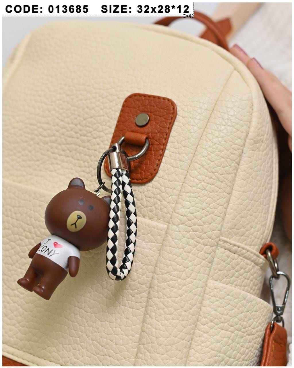 013685 — Cream bear-charm backpack detail, 32 × 28 × 12 (Cream)