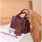 013775 — Burgundy structured leaf-detail handbag front, 16 × 24 × 11 (Burgundy)