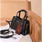 013775 — Black structured leaf-detail handbag front, 16 × 24 × 11 (Black)