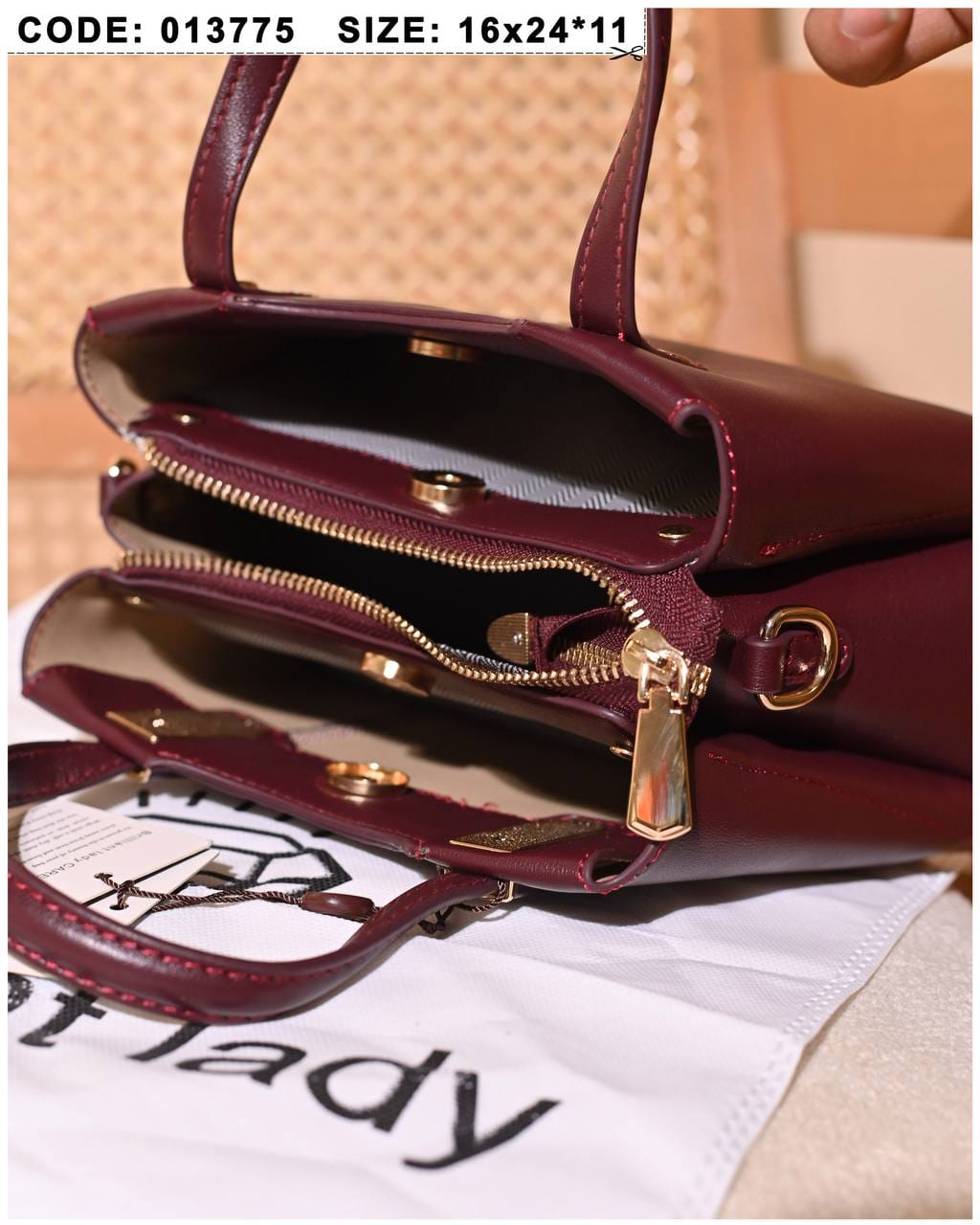 013775 — Burgundy structured leaf-detail handbag interior, 16 × 24 × 11 (Burgundy)