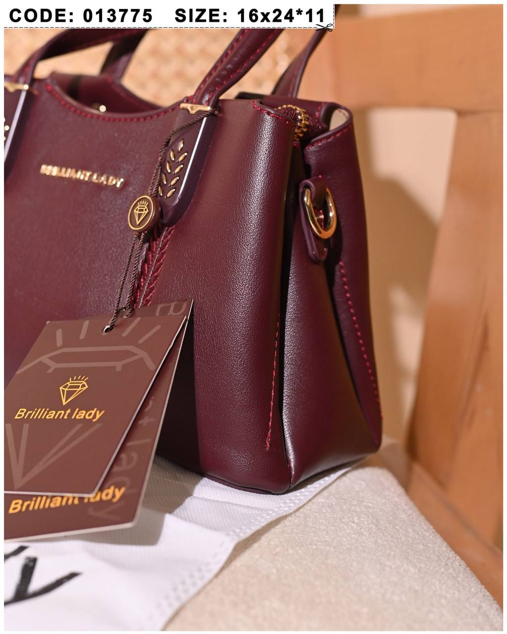 013775 — Burgundy structured leaf-detail handbag detail, 16 × 24 × 11 (Burgundy)