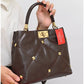 013803 — Brown diamond-quilted stud handbag detail, 22 × 28 × 10 (Brown)
