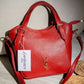AD1017 — Red buckle-handle handbag front, 23 × 20 (Red)