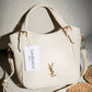 AD1017 — Ivory buckle-handle handbag front, 23 × 20 (Ivory)