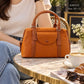 AM543 — Tan front-pocket handbag front, 28 × 21 (Tan)
