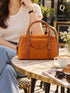 AM543 — Tan front-pocket handbag front, 28 × 21 (Tan)