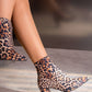 S1442 leopard print heeled ankle boot from side, pointed toe and block heel