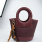 BAG_7 — Burgundy oval-handle bucket handbag front (Burgundy)