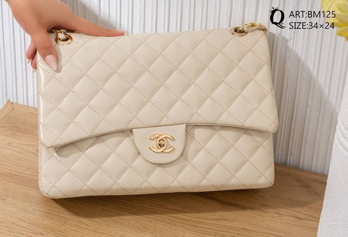 BM125 — Ivory quilted chain shoulder bag front, 34 × 24 (Ivory)