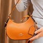 FR03 — Orange crescent shoulder bag front (Orange)
