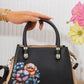 Mk151 — Black floral top-handle handbag front, 24 × 17 (Black)