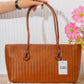 N149 — Cognac woven-pattern shoulder tote front, 38 × 21 (Cognac)