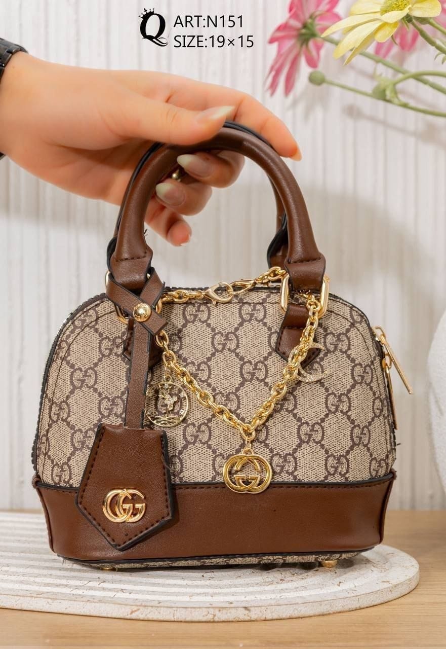 N151 — Brown mini patterned handbag front, 19 × 15 (Brown)